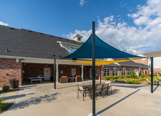 Sun Canopy with Outdoor Dining Table and Chairs