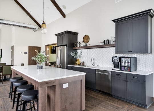 Clubhouse Kitchen with Large Kitchen Island and Bar Stool Seating