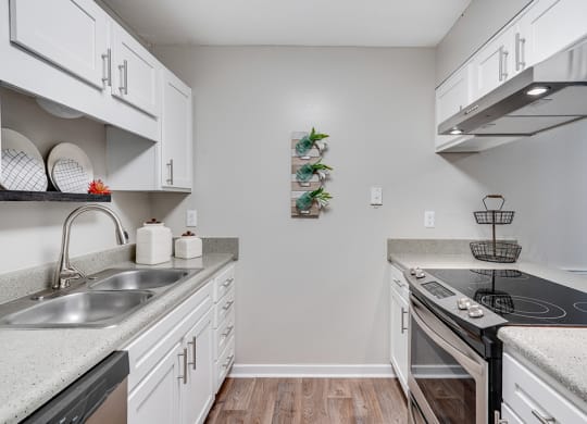 Kitchen with White Cabinetry and Stainless Steel Appliances