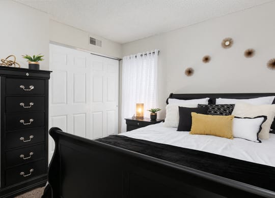 Bedroom with Sliding White Closet Doors