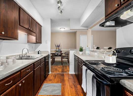 Kitchen with Dark Brown Cabinetry and Stainless Steel Appliances