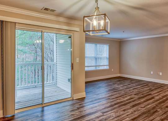 Spacious Living Area With Wood-Style Flooring