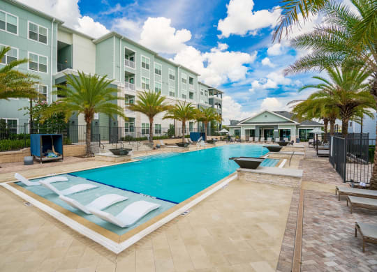 Inviting Pool & Sundeck With Sun Lounger Chairs & Cabanas