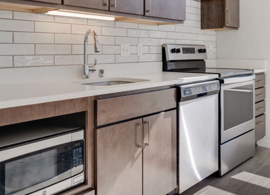 Kitchen with white countertops and stainless steel appliances