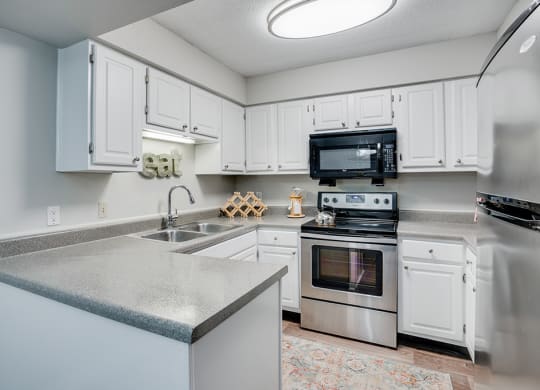 Kitchen with Stainless Steel Appliances and White Cabinetry