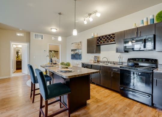 Spacious Kitchen With Bar Stool Seating At The Kitchen Island