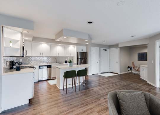 Spacious entryway with wood style flooring