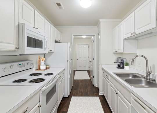Fully Equipped Kitchen with White Appliances