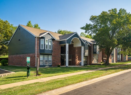 Exterior Of Apartment Homes At Willowbend Surrounded With Lush Grass