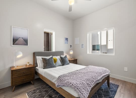 a bedroom with a bed and two windows at SECOND AVE COMMONS | BRAND-NEW, Arizona
