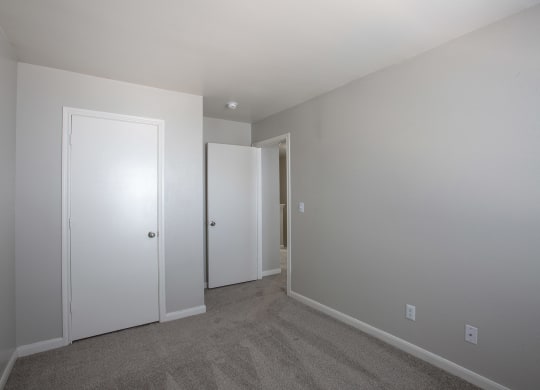 Bedroom with Carpet and Closet at The Bluffs at Tierra Contenta Apartments in Santa Fe New Mexico