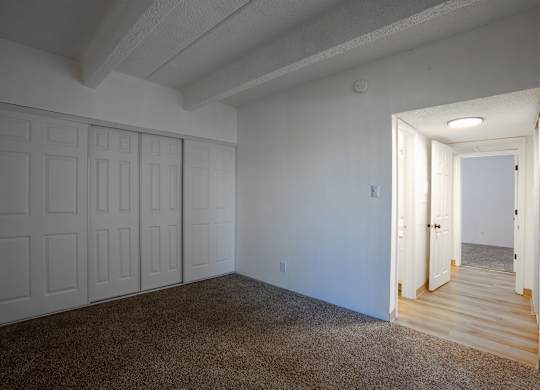 Bedroom with carpet at Los Altos Towers Apartments in Albuquerque NM
