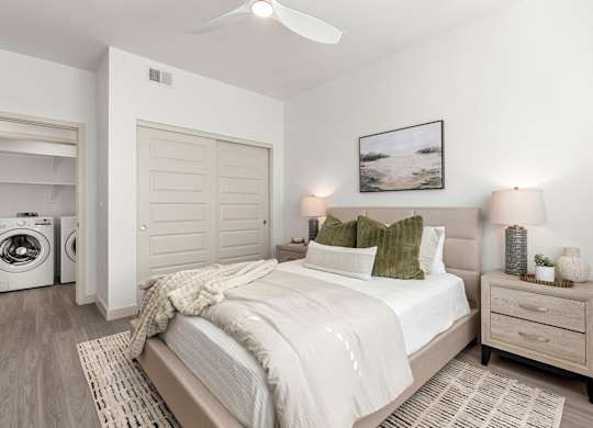 Bedroom with Washer and Dryer in Two Bedroom and Two Bath at Lucero Apartment Homes in Phoenix Arizona