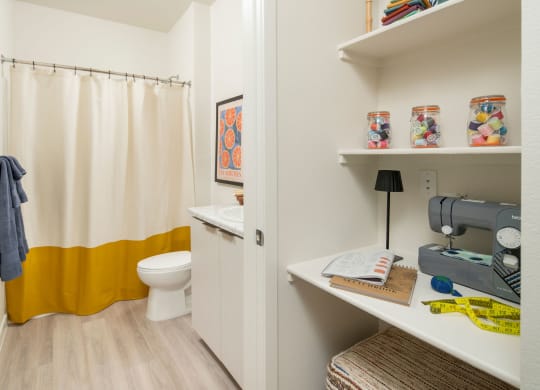 Built in desk and bathroom at Streamliner 16th Apartments in Phoenix