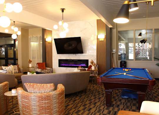 Clubhouse Seating and Billiards at Los Altos Towers Apartments in Albuquerque NM