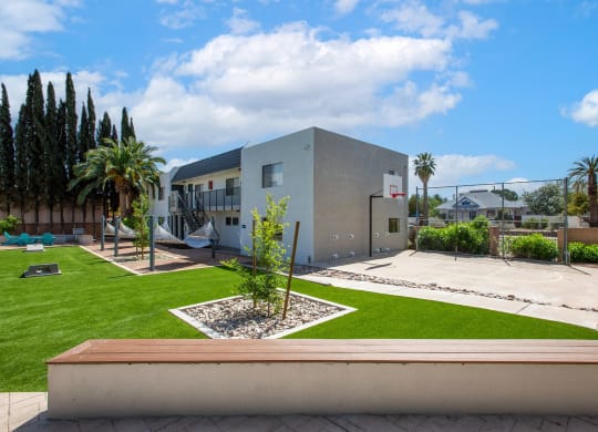 Corn Hole Game Area and Basketball Court at The Link at 4th Ave Apartments
