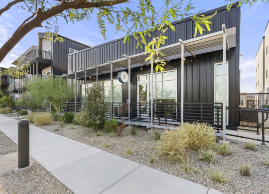 the exterior of a building with tables outside and a sidewalk at SECOND AVE COMMONS | BRAND-NEW, Arizona, 85210