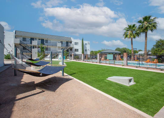 Hammock Lounge Area and Cornhole Playing Area at The Link at 4th Ave Apartments