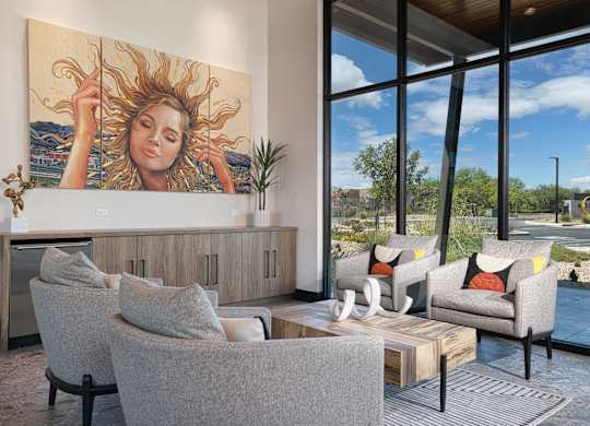 A living room with a large painting of a woman with sun in her hair.