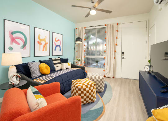 Living room and bedroom of Studio at Streamliner 16th Apartments in Phoenix Arizona