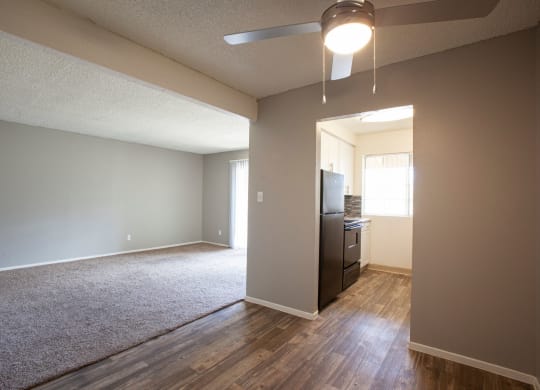 Living room and dining area at Brookwood Apartments in Tucson AZ 3-2020