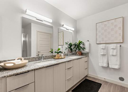 Main Bathroom with Double Vanity in Two Bedroom and Two Bath at Lucero Apartment Homes in Phoenix Arizona