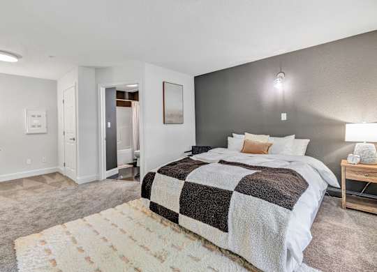 a bedroom with a bed and a rug at The Meriden, Meriden, CT 06450
