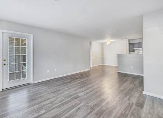 A room with a wooden floor and a white door. at Ardenwood Apartments, North Haven, Connecticut, 06473