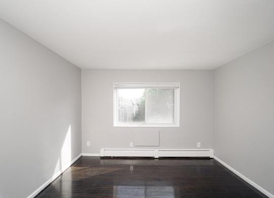 an empty room with white walls and a window at Encore 99, Connecticut, 06512
