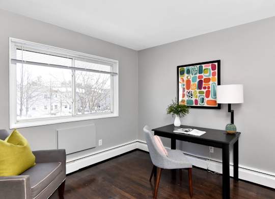 a living room with a couch and a desk and a window at Encore 99, Connecticut, 06512