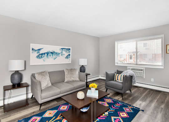 a living room with a couch and a coffee table at Encore 99, East Haven, Connecticut