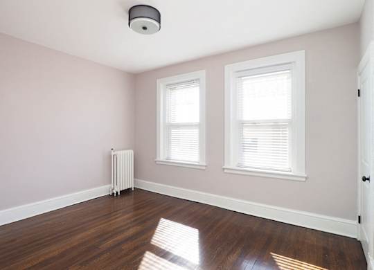 Room with window and wooden floor at The Packard, West Hartford
