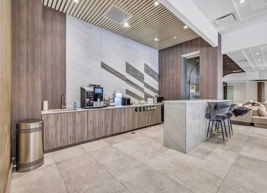 a lobby with a bar and a couch at Up House, Farmington, CT
