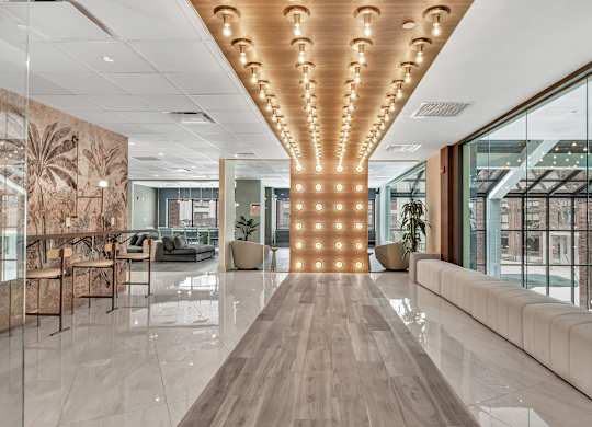 a large lobby with a row of lights on the ceiling at Up House, Farmington, 06032