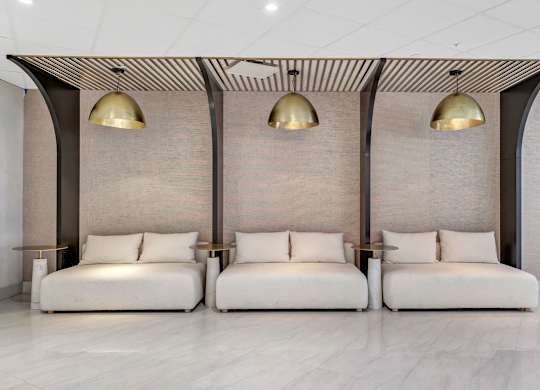 a seating area with two couches and three lamps at Up House, Farmington, Connecticut