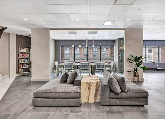 a lobby of an office building with couches and a table at Up House, Farmington, CT, 06032