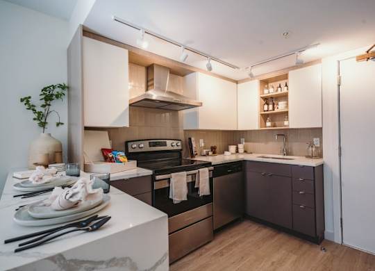 a kitchen with a stove and a sink at Up House, Farmington, CT