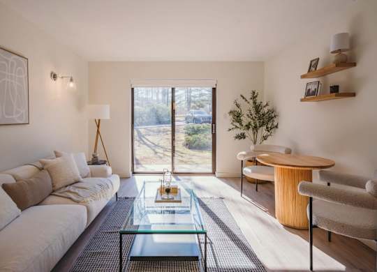 a living room with a couch and a glass table at Up House, Connecticut, 06032