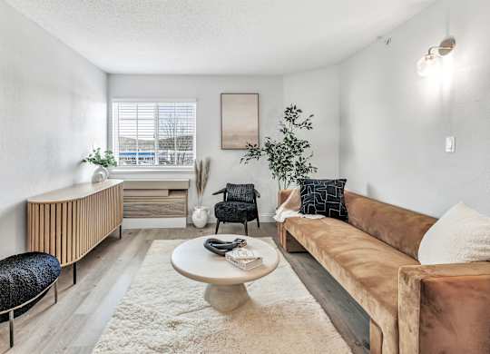 a living room with a couch and a coffee table at The Meriden, Connecticut, 06450
