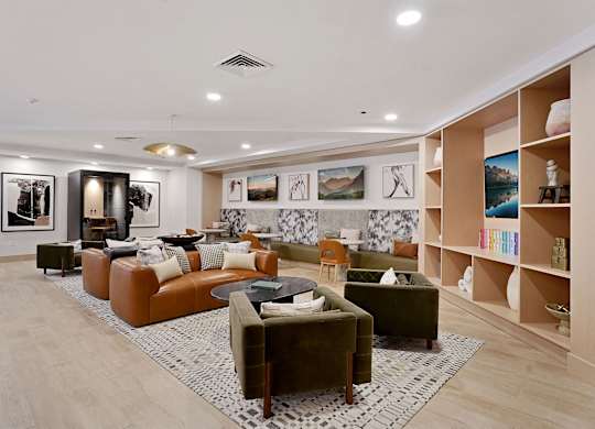 A living room with a large couch and a coffee table.