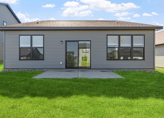 a home with a lawn in front of it