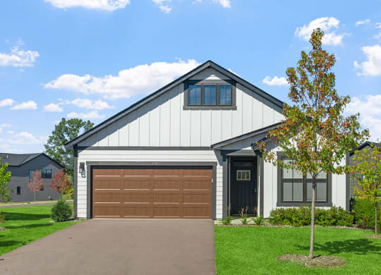 the front of a house with a garage door