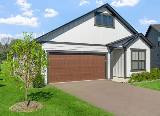 a garage door in front of a house