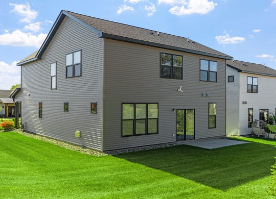 a large house with a yard in front of it