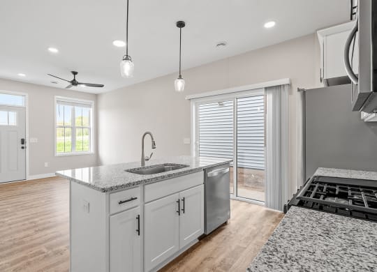 a kitchen with a sink and a stove