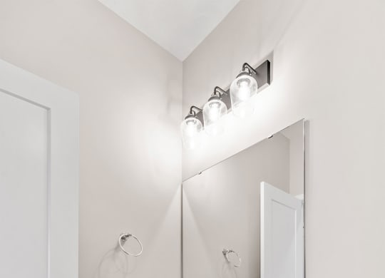 a bathroom with a white sink and toilet and a white door