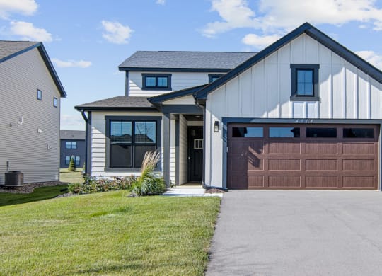 a house with a brown garage door