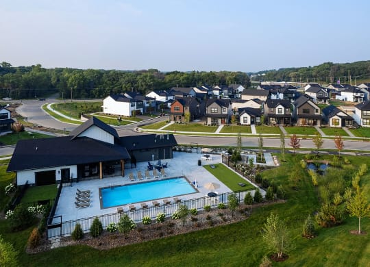 an aerial view a rental home community and an outdoor pool