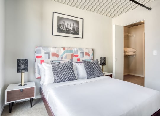 a bedroom with a large bed and a closet