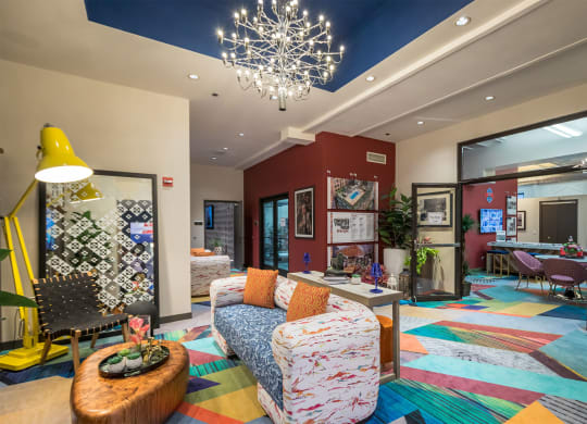 a living room with couches and chairs and a fireplace